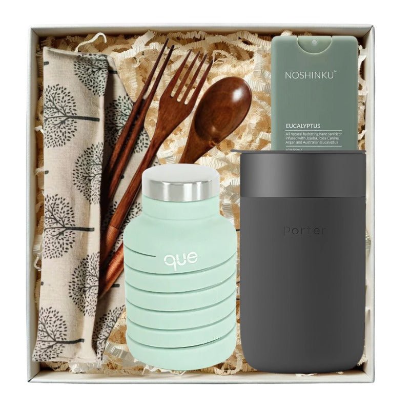 Zero Waste Warrior Starter Kit with a collapsible water bottle from QUE, ceramic travel cup, sanitizer, and travel cutlery.
