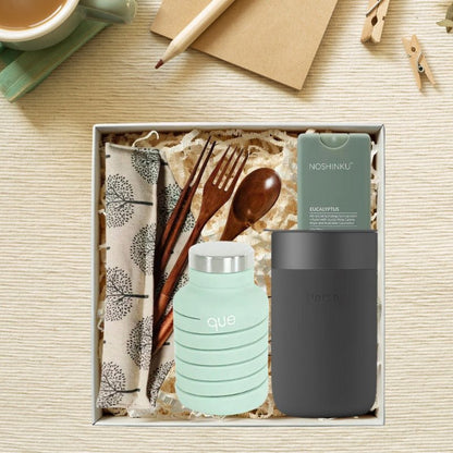 Zero Waste Warrior Starter Kit with a collapsible water bottle, ceramic travel cup, sanitizer, and travel cutlery.