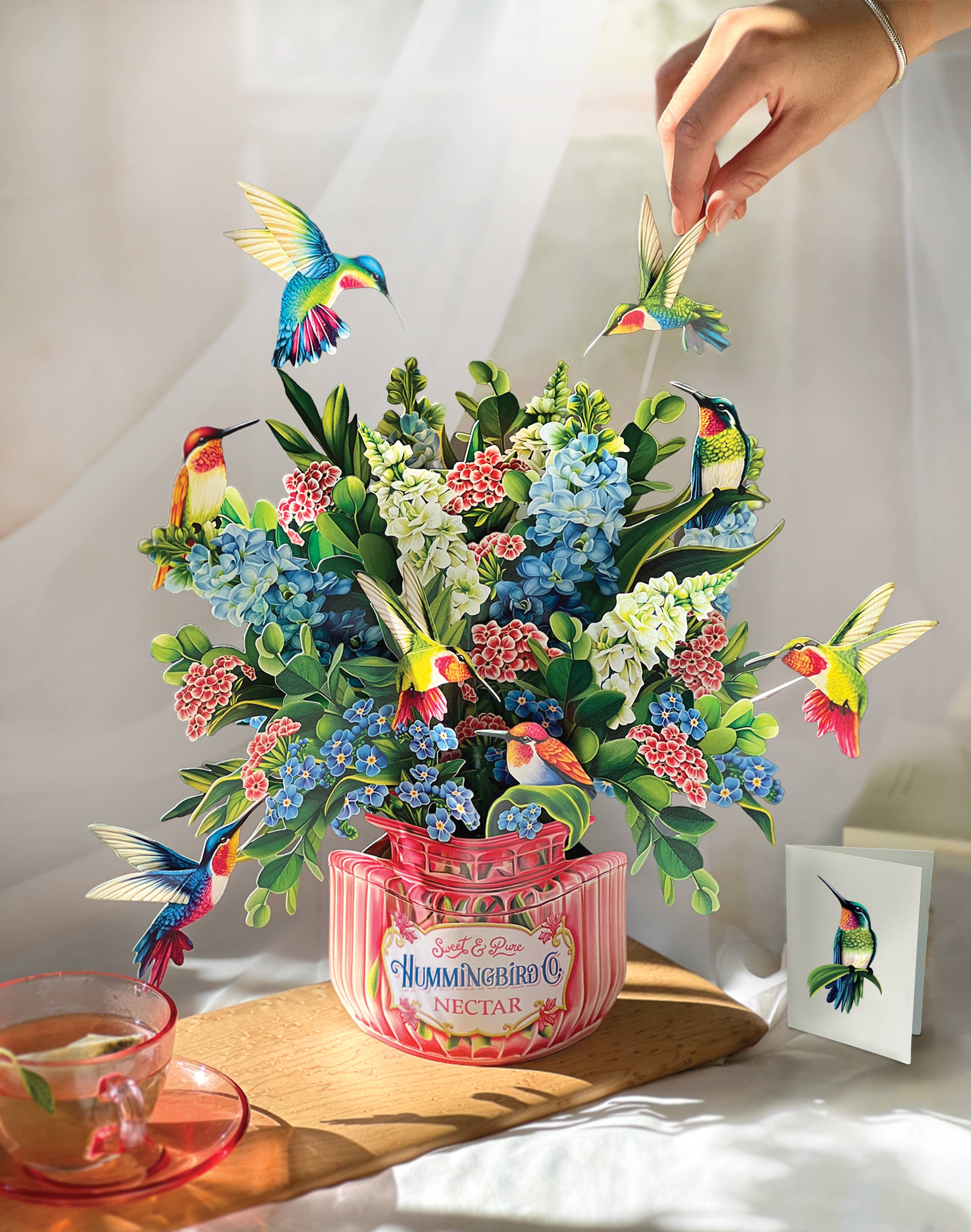Hummingbird Oasis Pop-up Greeting Card, perfect for curated gift boxes and Build a Box gifting (lifestyle photo)