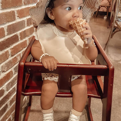 Silicone Baby Bib, perfect for gifts for kids and curated gift boxes (lifestyle photo)