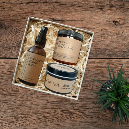 Three natural skincare products in a gift box for employee wellness