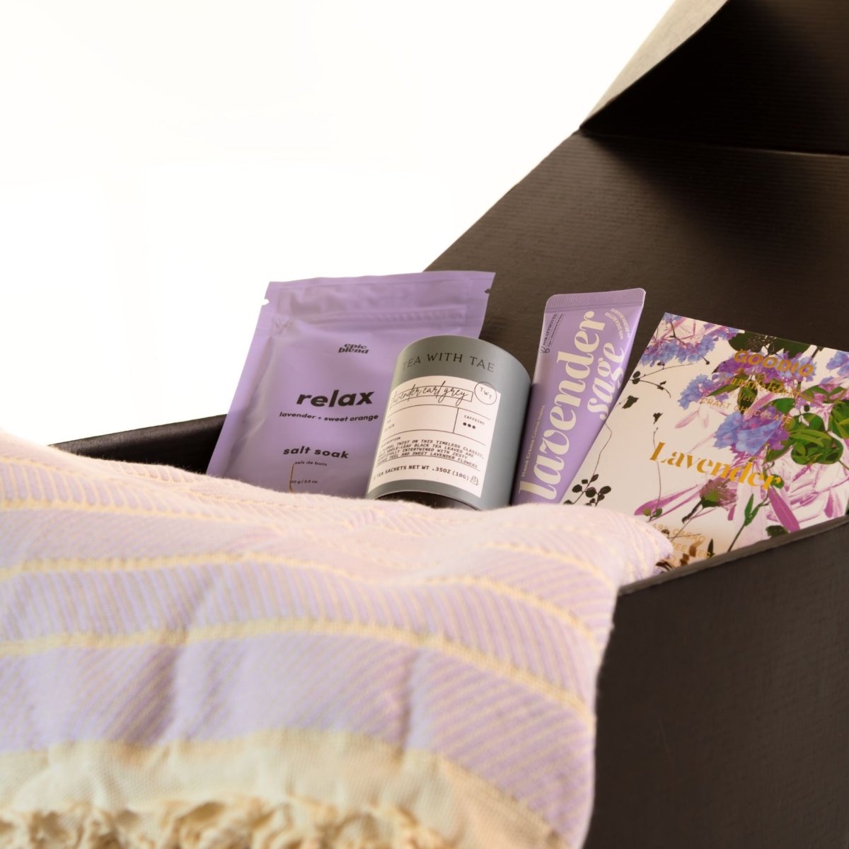 The Lavender Healing Gift Box combines spa essentials, tea, chocolate, and a cozy blanket, making it a thoughtful choice for recovery, stress relief, self-care gifting, and everyday comfort.
