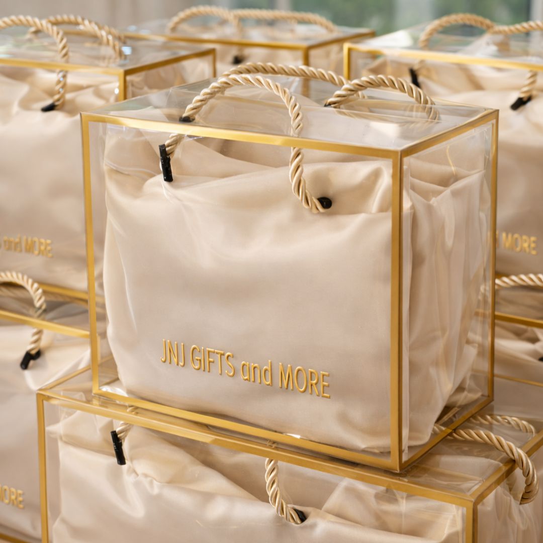 Luxury sleep and relaxation gift set with mulberry silk pillowcase, silk eye mask, and pillow spray arranged in a clear gift box