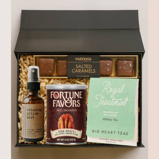 Gift box with Mayana salted caramels, Fortune Favors product, and Big Heart Teas tea as speakers gifts