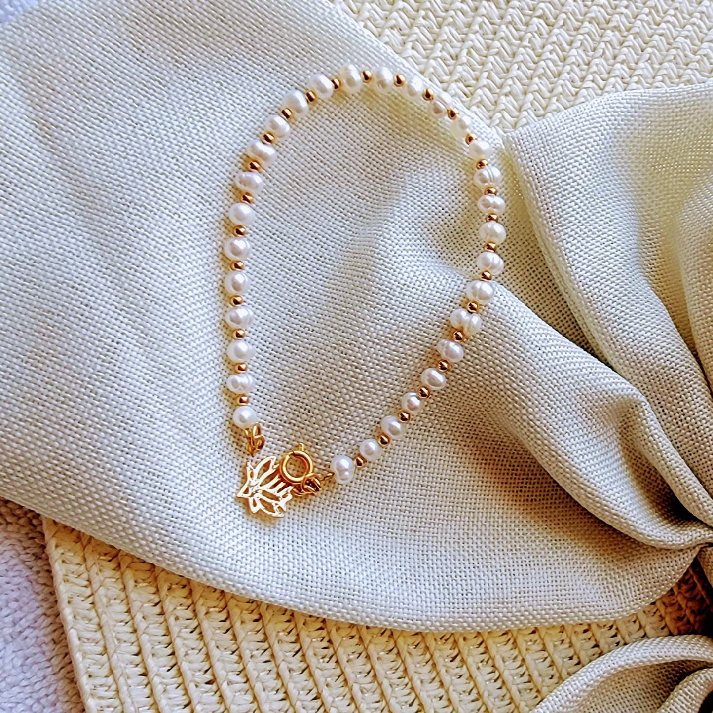 Natural pearl bracelet with lotus charm