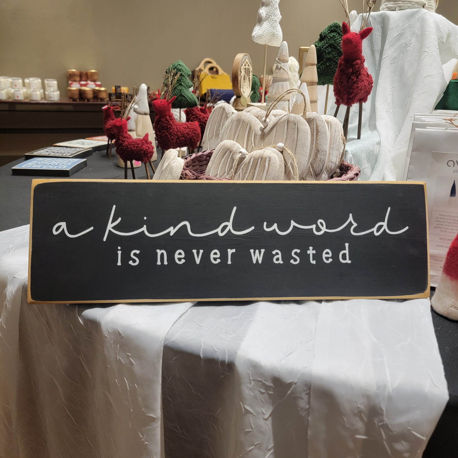 A kind word is never wasted wooden sign