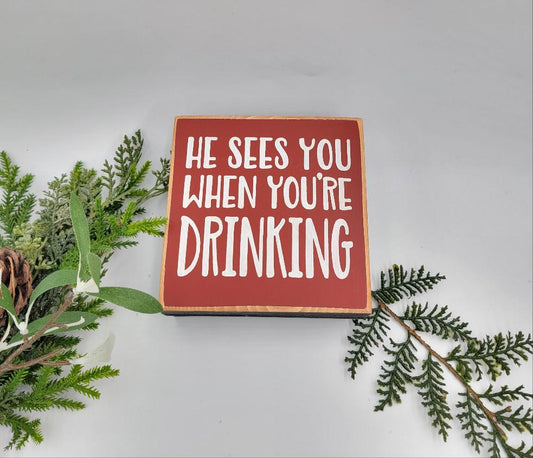 He sees you when you are drinking wooden sign decor
