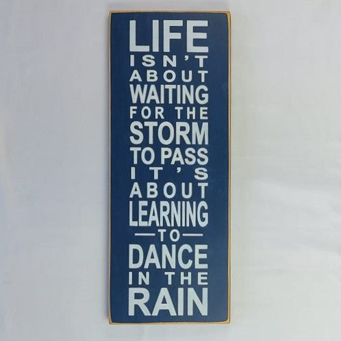 Motivational Sign - Life Isn't About Waiting For The Storm To Pass